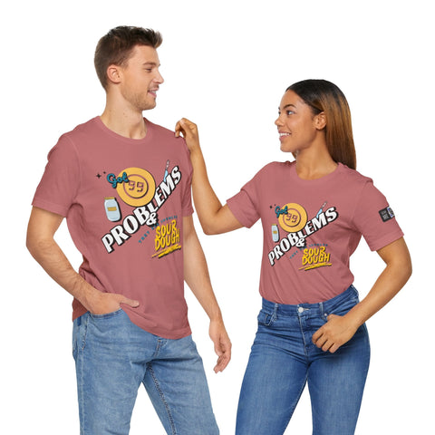 Unisex short sleeve tee with 99 Sourdough Problems graphic in dusty rose color on casual fit shirt