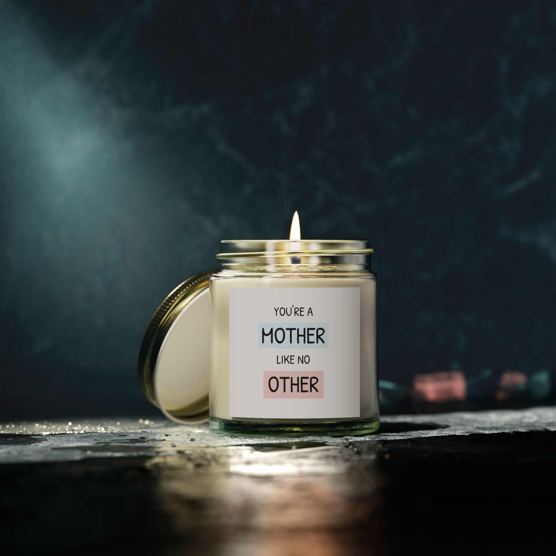 Scented candle with "You're a Mother Like No Other" label, coconut apricot wax, in a reusable glass jar.