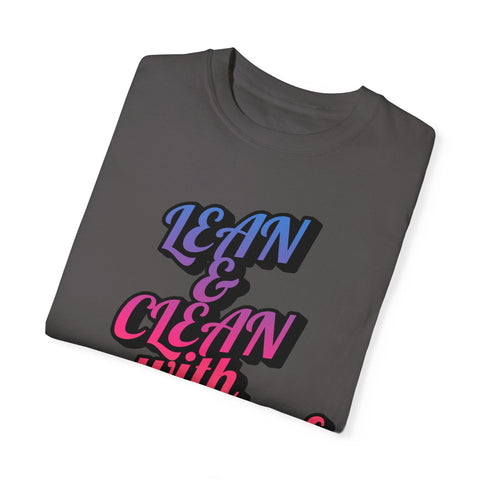 Unisex garment-dyed T-shirt with "Lean & Clean" motivational print, folded neatly.