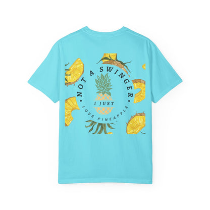 Light blue unisex t-shirt with fun pineapple graphic and "Not a swinger, I just love pineapple" text design.