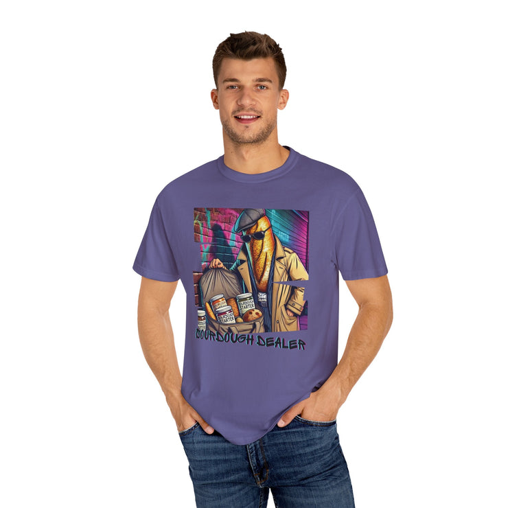 Man wearing a purple "Sourdough Dealer" t-shirt featuring a colorful graphic design.