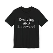 Unisex jersey short sleeve tee with "Evolving and Empowered" text, black color.