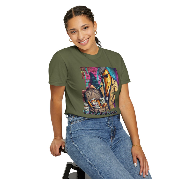 Unisex garment-dyed Sourdough Dealer T-Shirt in green with playful print design, worn by model.