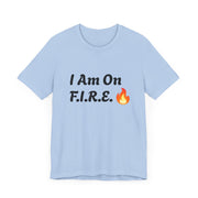 Motivational "I Am On F.I.R.E." T-shirt in light blue, featuring bold, spirited design with fire icon, perfect for F.I.R.E. Movement enthusiasts.