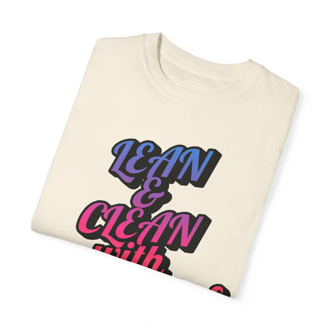 Unisex Garment-Dyed T-shirt with motivational "Lean & Clean" design, folded.