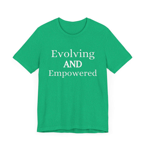 Green unisex jersey short sleeve tee with "Evolving and Empowered" text.