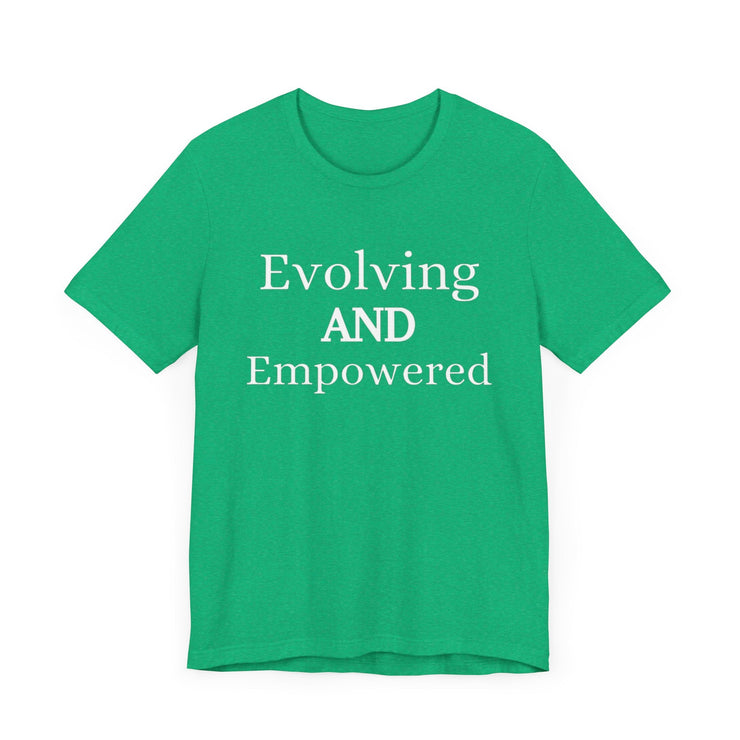 Green unisex jersey short sleeve tee with "Evolving and Empowered" text.