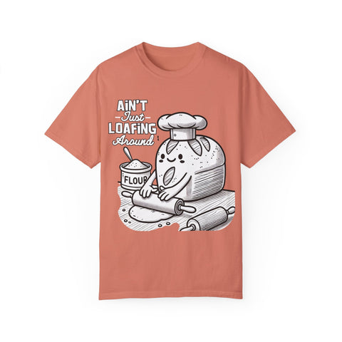 Comfort Colors 1717 t-shirt in coral with baking-themed design featuring bread loaf and flour.