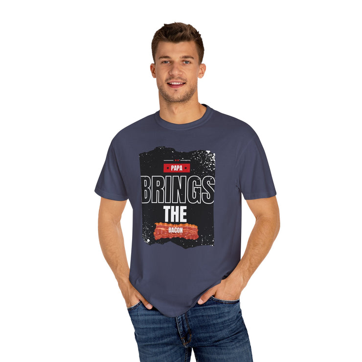 Unisex garment-dyed T-shirt with "Papa Brings the Bacon" design, perfect gift for dads.