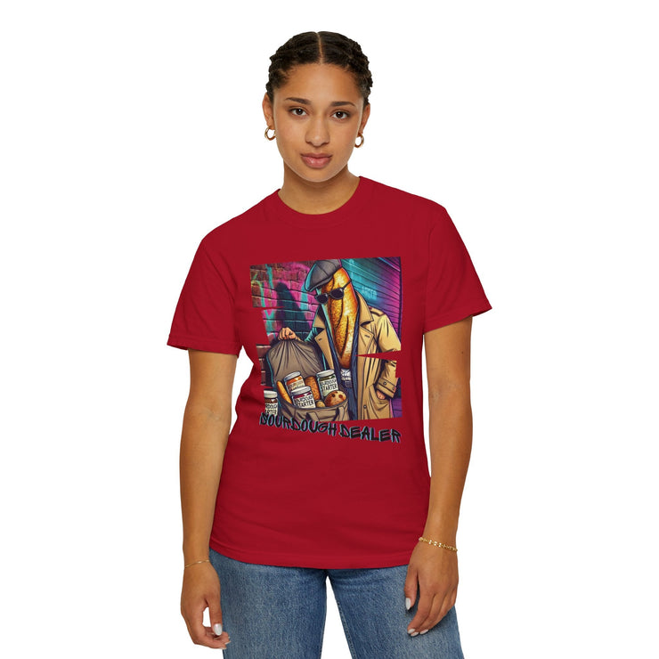 Sourdough Dealer T-Shirt featuring vibrant graphic design on red fabric, worn by a person.