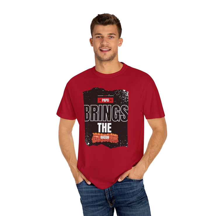 Unisex garment-dyed T-shirt with "Papa Brings the Bacon" design, perfect gift for dads.