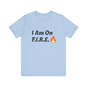 Light blue "I Am On F.I.R.E." motivational t-shirt promoting the F.I.R.E. Movement with flame graphic.